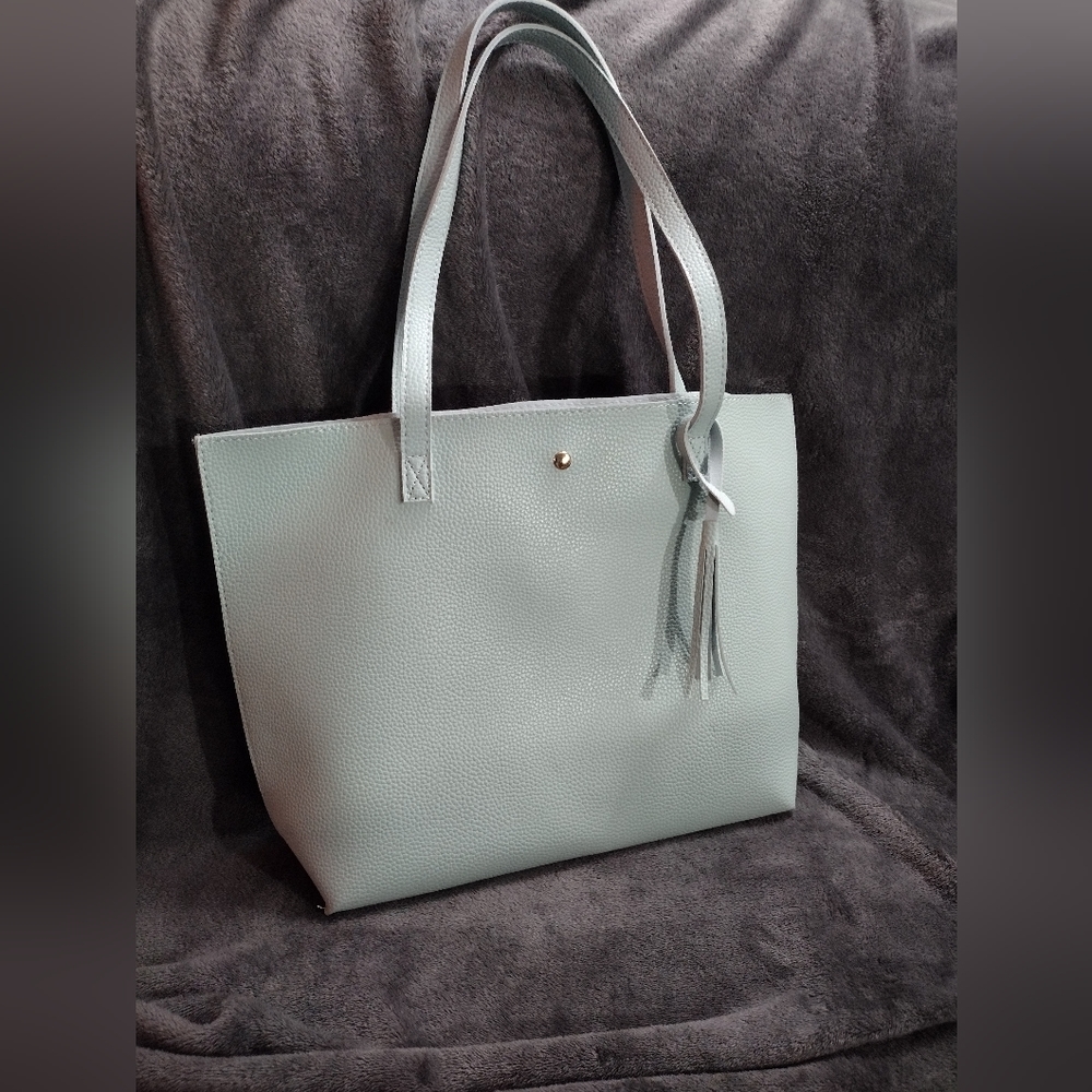 A very beautiful/stylish plain powder blue purse